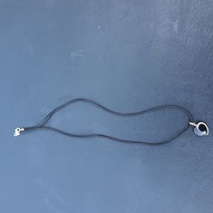 Black heart pendant on black lanyard. New.